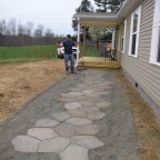 My husband and his perfected walkway. He's worked hard!